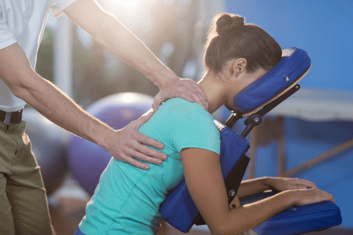 Physiotherapist treating a wonan's back